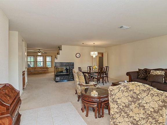 As you enter your new home, you are greeted by a spacious living and dining area.