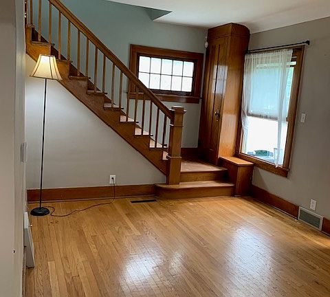 Living room with stairs going to 2nd floor