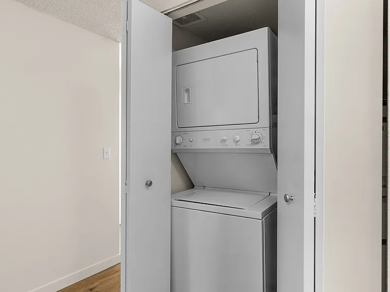 Efficient laundry solution with a stylish stacked washer and dryer. Efficient laundry solution with a stylish stacked washer and dryer.