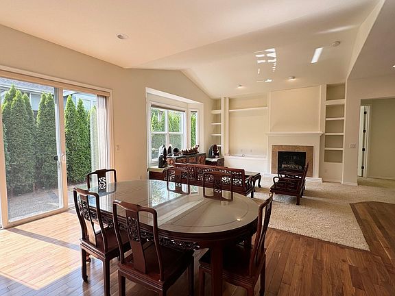 Another view of the great room with built in shelves and gas fireplace!