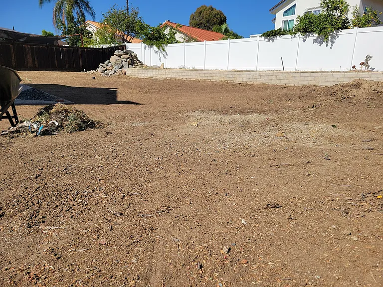 HUGE backyard with a raised, irrigated garden area. This area is a work in progress. Help us decide if you want it turned into a grass area (are you willing to pay additional water costs and maintain the lawn?)
