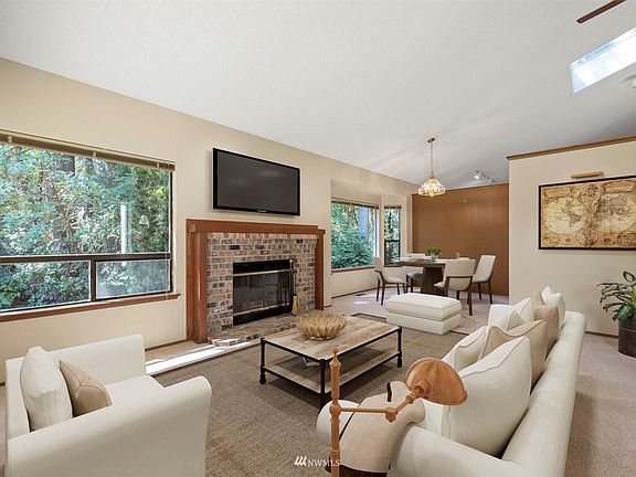 The living and dining areas are virtually staged.>