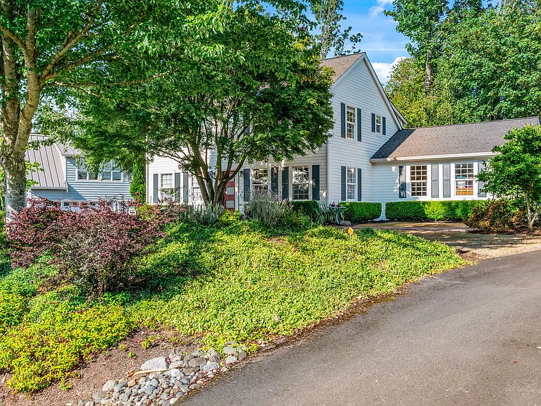 Beautiful, mature trees create a park-like front yard space.