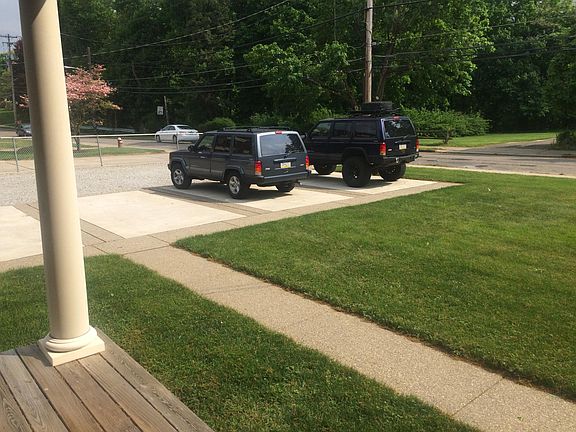 Porch, paved parking and walkways