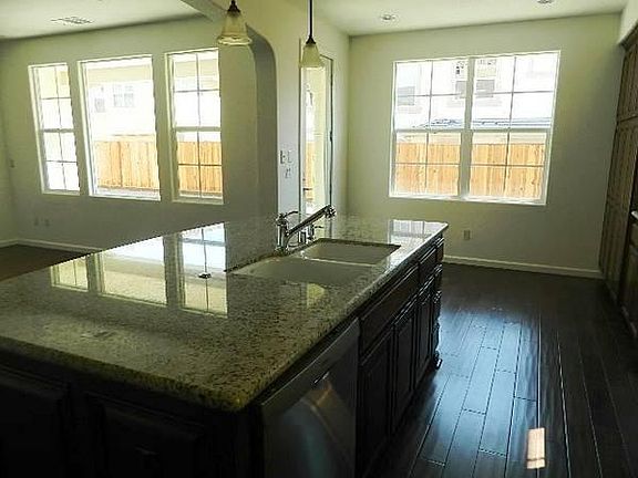Kitchen Island with Breakfast nook in background