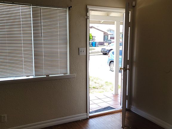 View to the driveway and the street from the living room
