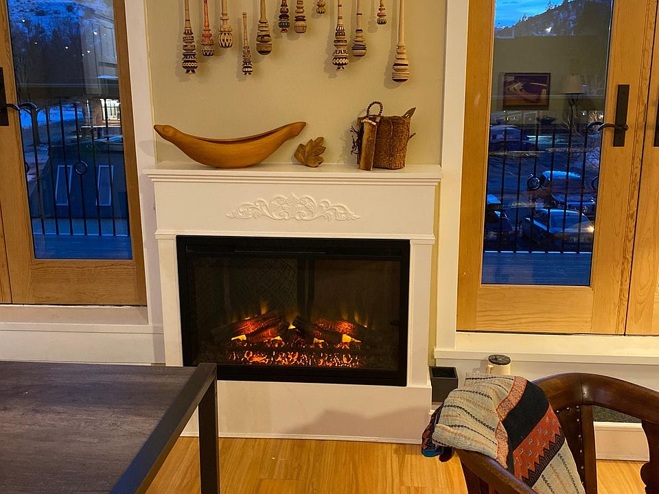Fireplace with French doors to balconies