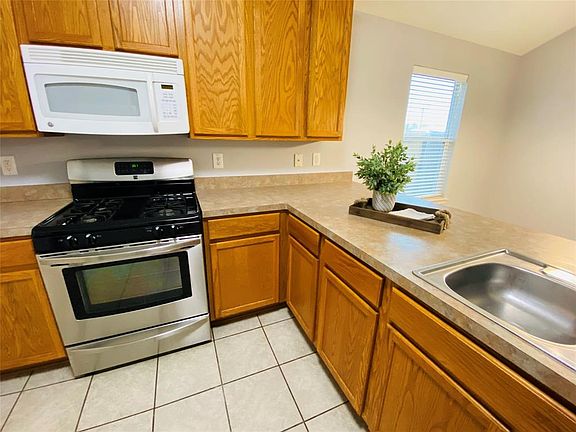 Kitchen with gas stove and built in microwave