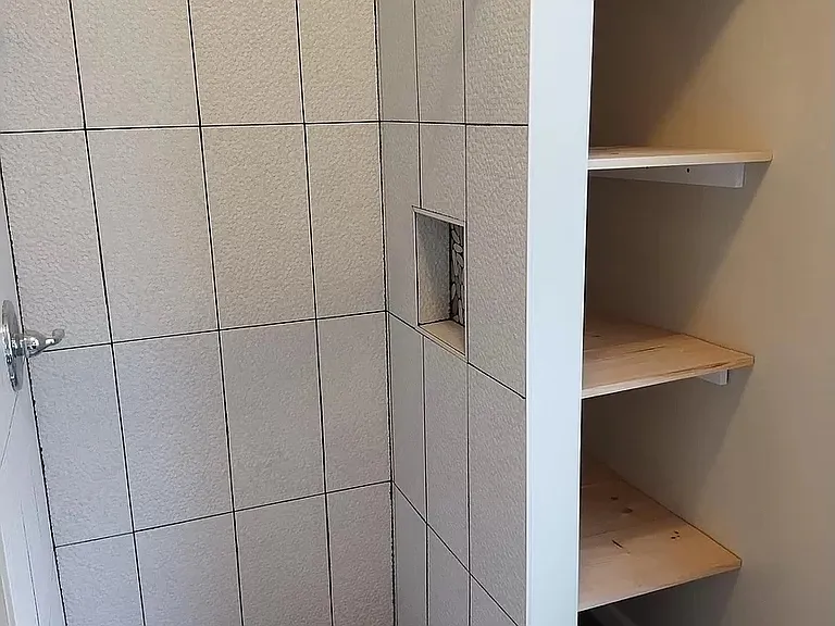 Bathroom. Shower and storage.