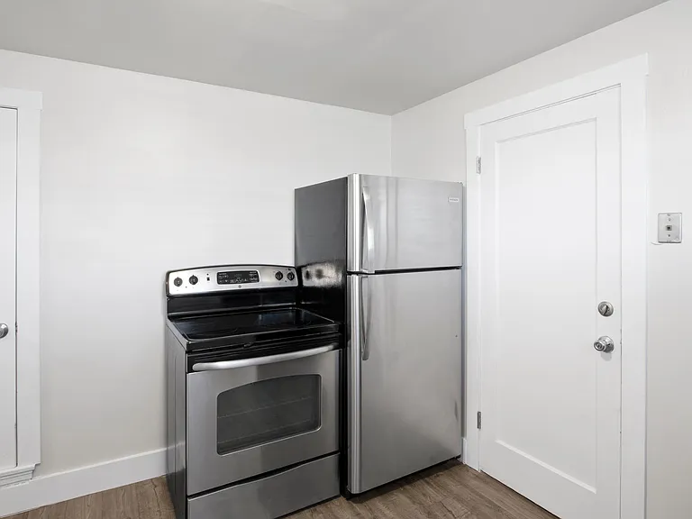 New stainless steel appliances. Exterior door leads to shared laundry