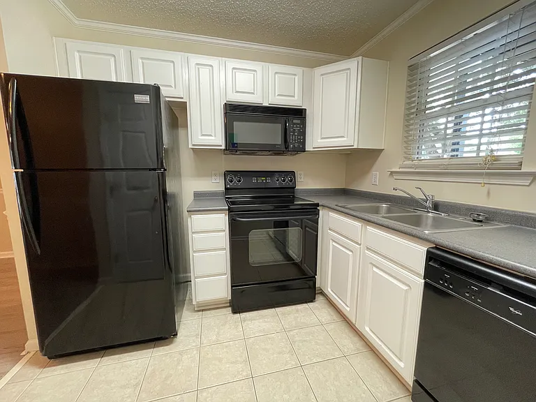 Functional kitchen with ample cabinet and pantry storage