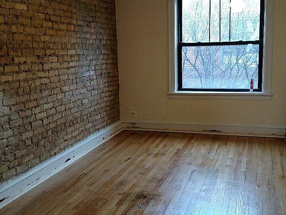 Exposed brick wall in living room