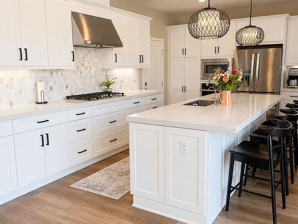 Entertainers kitchen, upgraded appliances, marble backsplash.