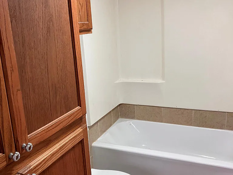 Second full bath with linen storage