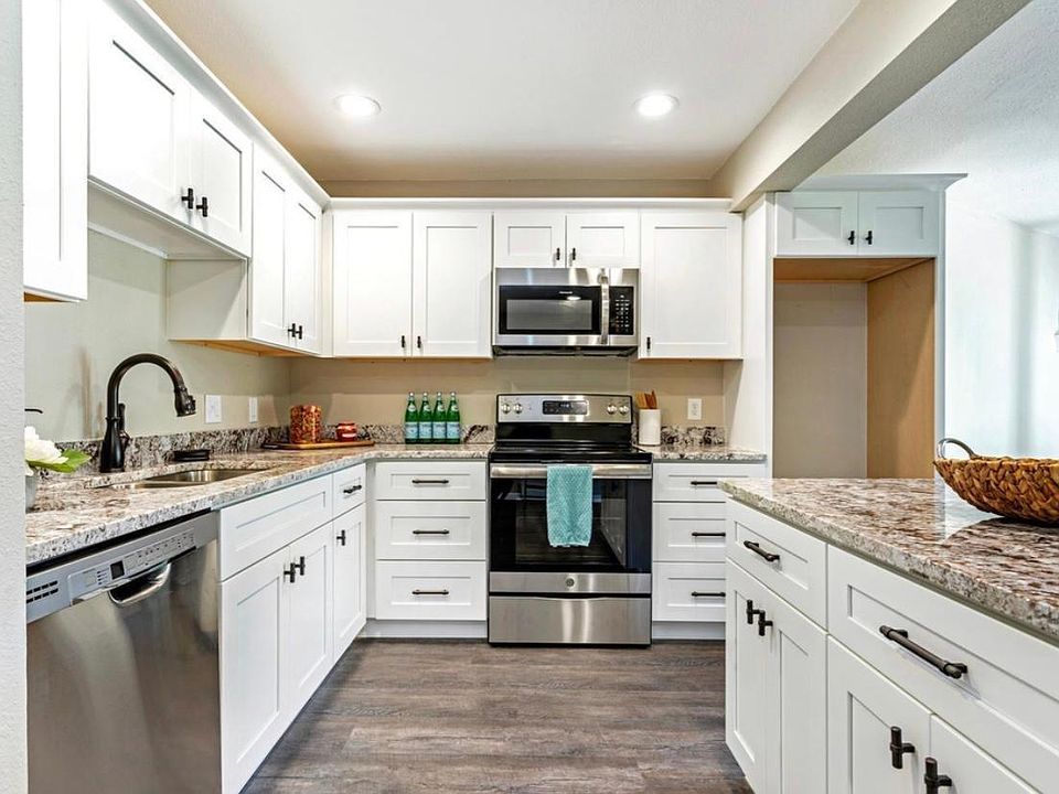 Newly updated kitchen. Unit DOES have stainless steel fridge.