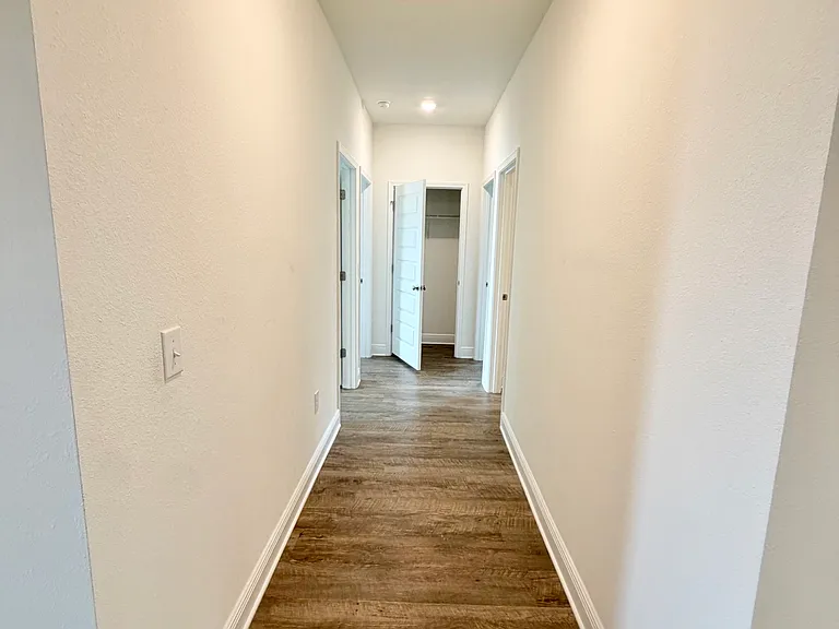 Hallway Leading to 3 guest bedrooms & 1 full bath