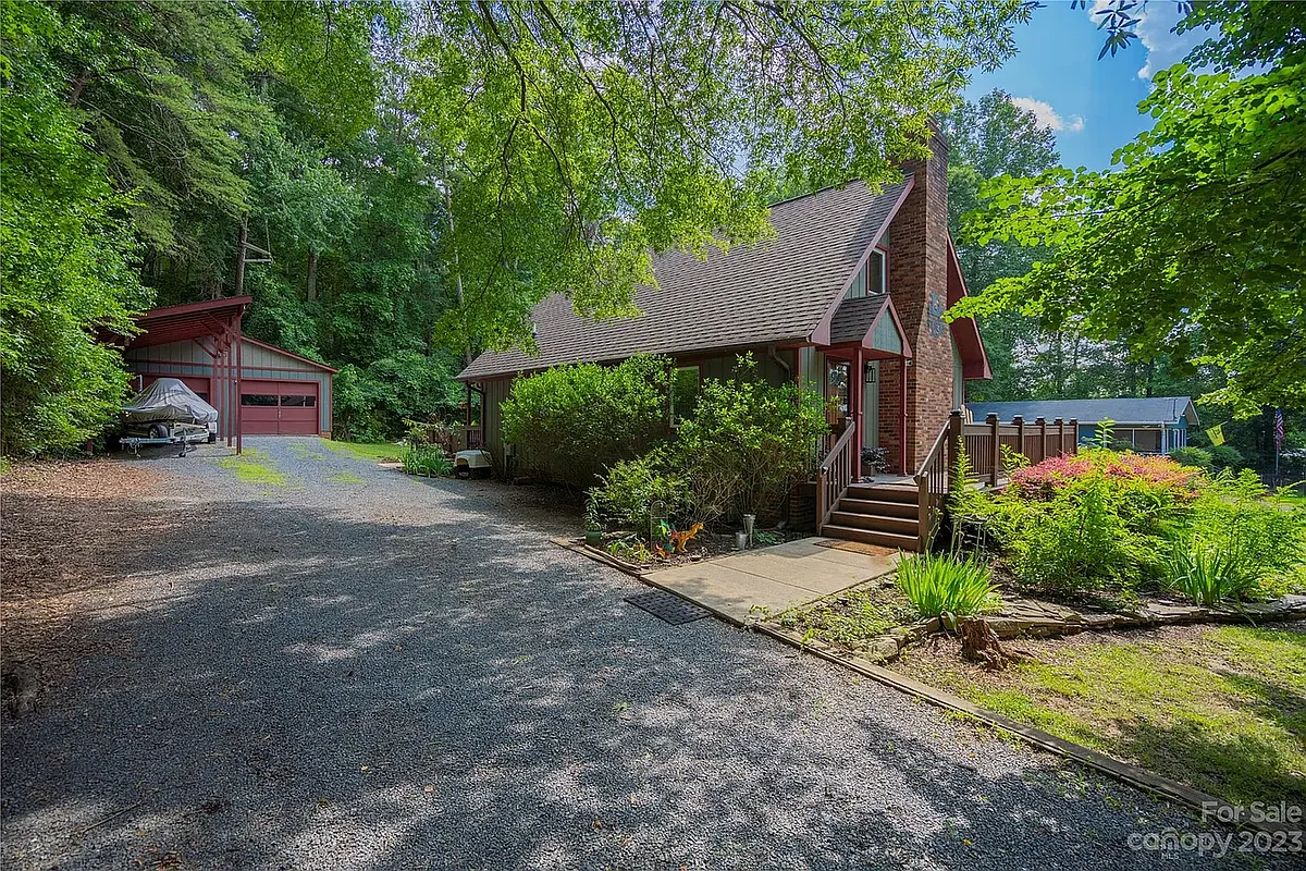Off street parking with detached wired garage and covered boat storage. - 240 Horseshoe Dr