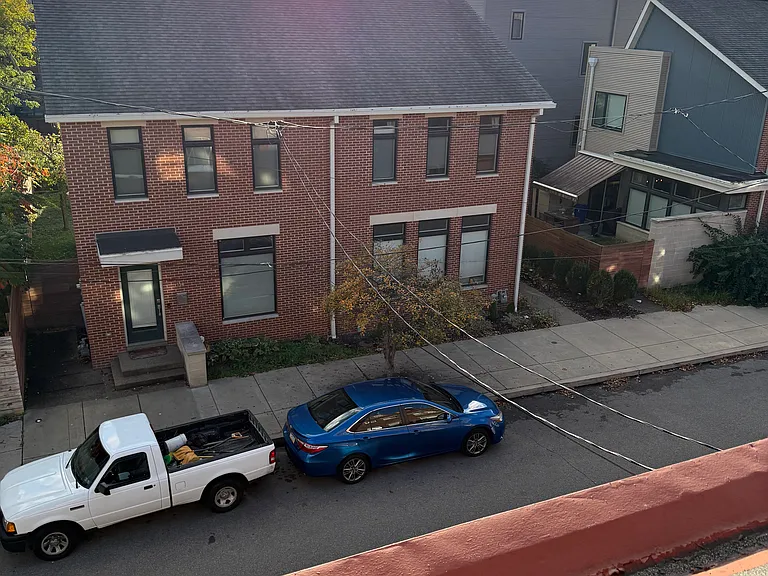 3rd Floor glorious views of new brick housing directly across the street, as well as long views of Pittsburgh's rolling hills and urban, downtown area
