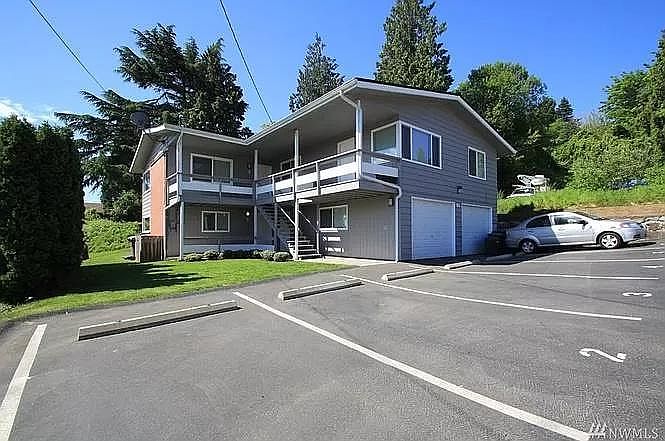 Front of the house; unit 1 consists of both stories on the right side.