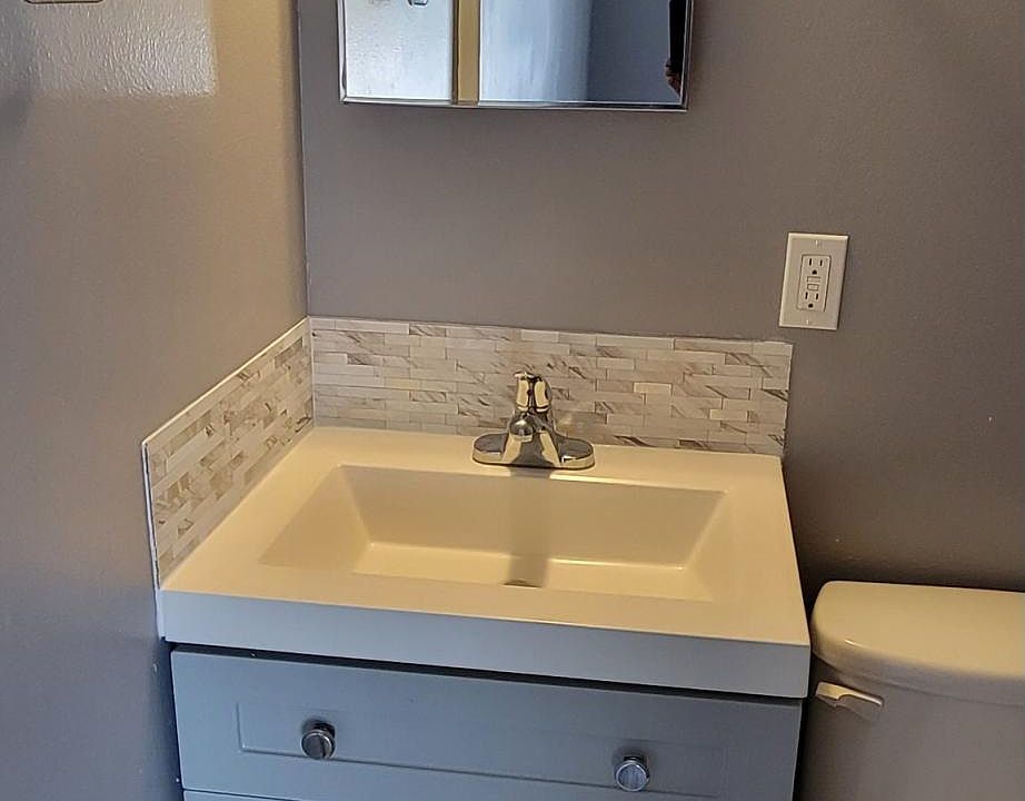 1/2 Bath with new cabinet, tile
