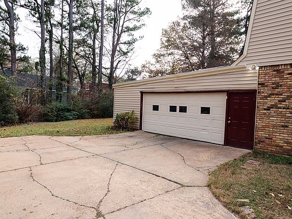 Attached 2 car garage with BONUS storage area.