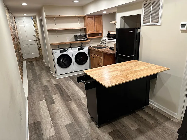 kitchen includes bar, washer & dryer. Door to fenced back yard.