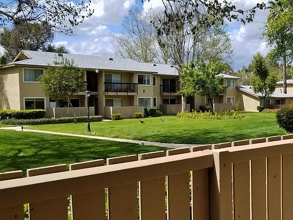 All units have large patios/balconies with views of the large green belt.