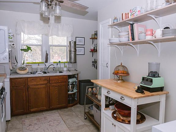 Large kitchen includes a walk-in pantry, built-in microwave, ceiling fan, your own washer/dryer, a tenant's favorite