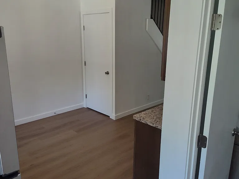 Looking at the kitchen from standing by the backdoor.