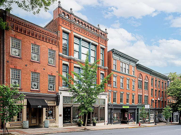 Explore the elegance of urban living with these picturesque brick buildings.