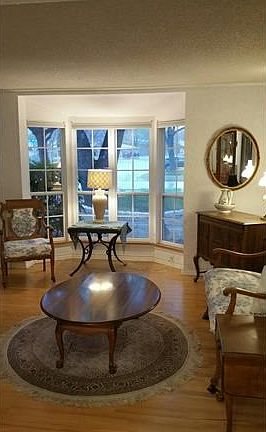 Formal living room with large bay window.