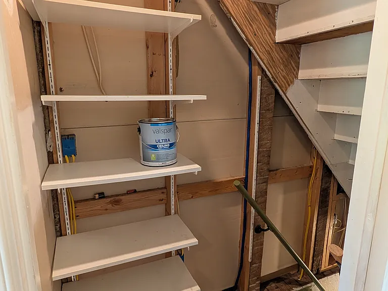 shelving going down basement stairs.