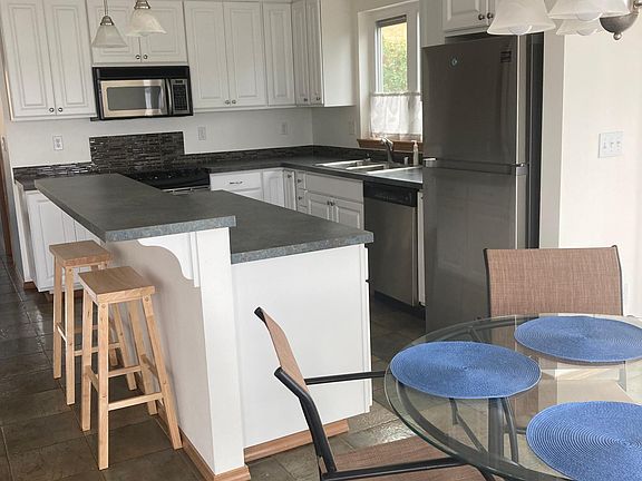 Kitchen with Island/Breakfast Bar.
Microwave, Range, DW, Referigerator