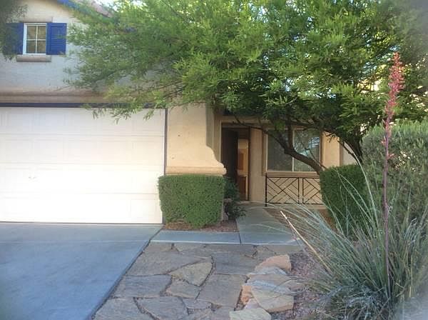 Front view with little patio in the front entryway