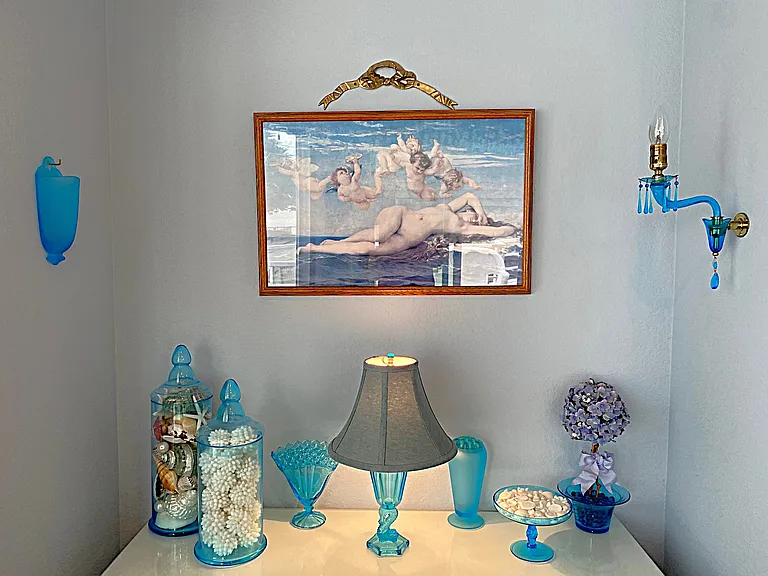 The Sea Angel is curated in Blue Depression Glass mirroring the Serene Ocean Vistas outside
