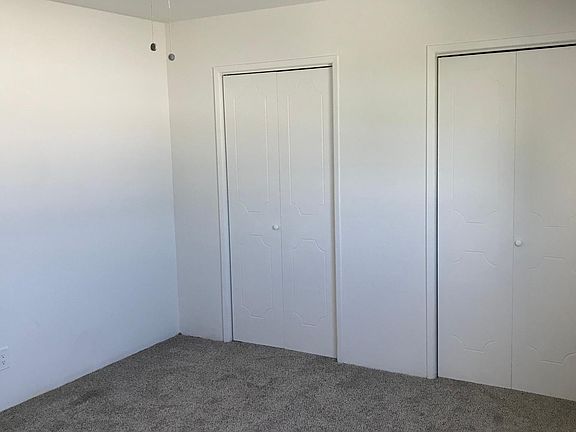 bedroom #2 very large new fan, carpet and lots of closet space