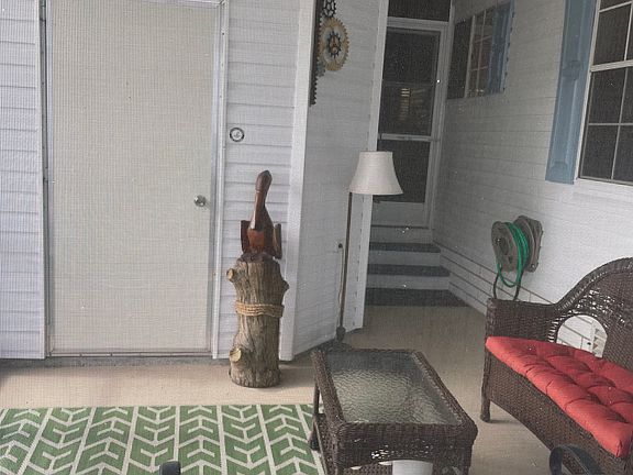 Screened-In Front Porch with Shed