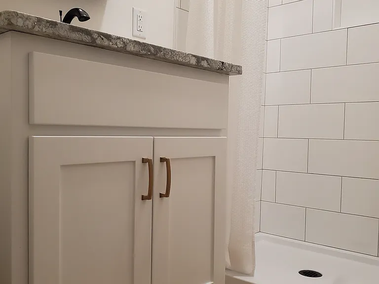 High quality custom cabinet, granite counter and tile shower