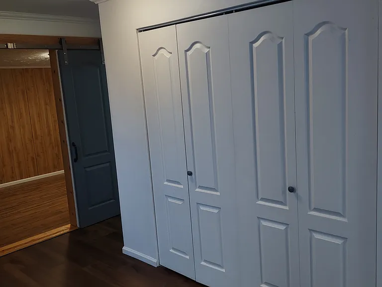 Landry room doors Master bed in the background.