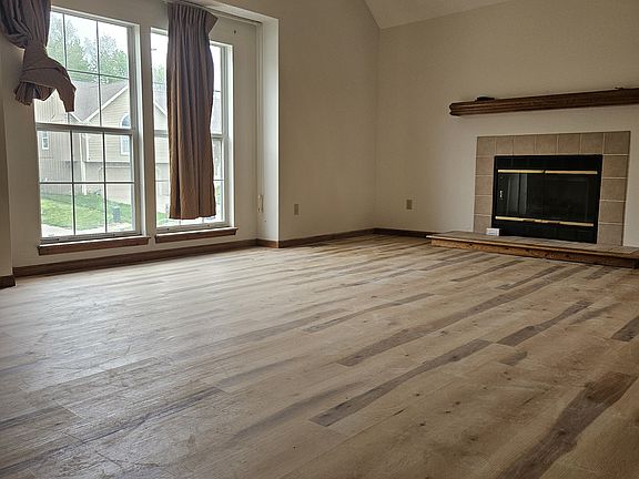 Living room with vaulted ceiling.