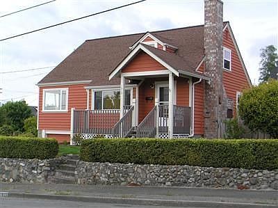 Front of the home with english style gardens