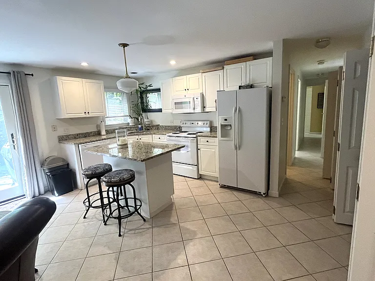 Kitchen and kitchen island with breakfast bar