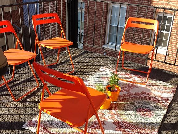 sunny private outdoor space, large enough for table, grill