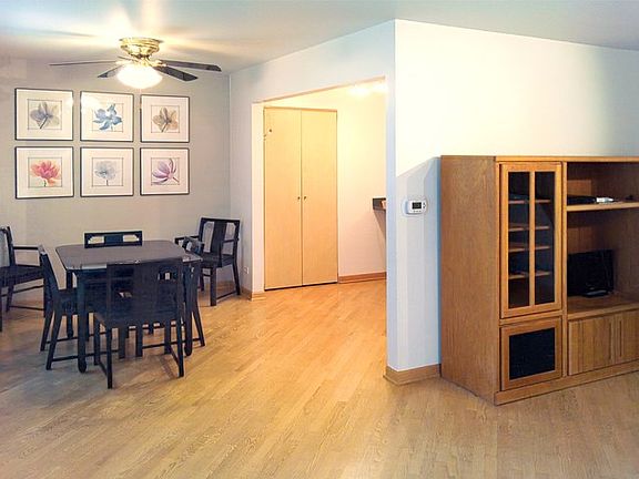 Hardwood floors continue through to dining room and kitchen.