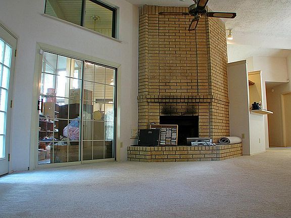 The enclosed sun porch also leads to the back yard. Presently, the sun porch and kitchen are full of items being moved out of the home.
