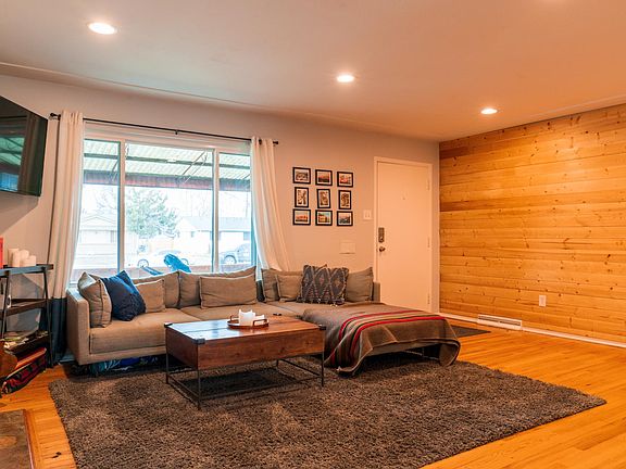 warm accent wall and space for your comfy couch in the living room