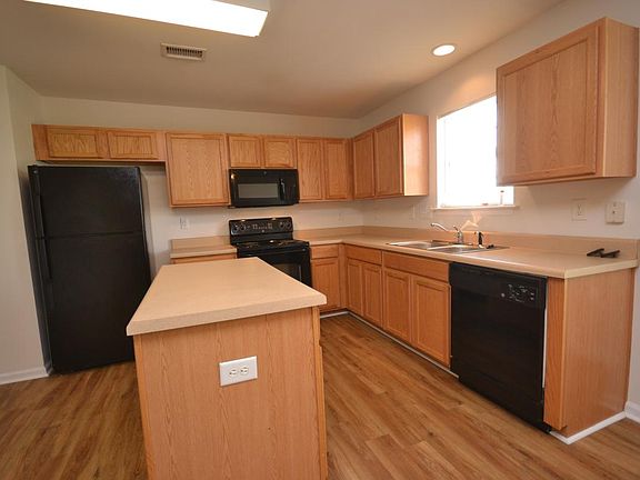 Kitchen has center island and includes all appliances