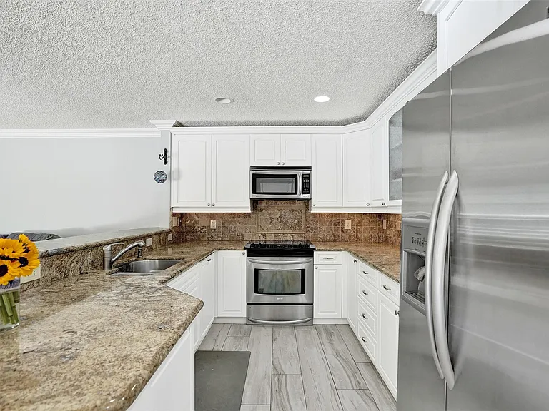 4142 NW 58th Dr — Photo 18