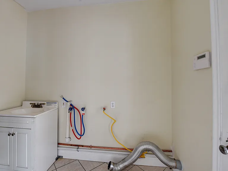Washer/dryer hookup in dedicated laundry room (1st floor)