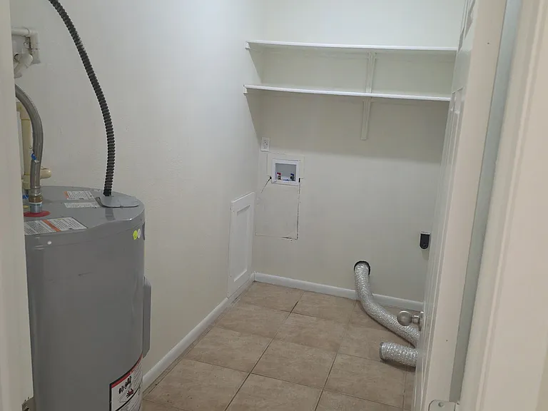 Large laundry room with hookups